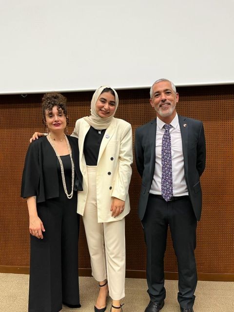Hadeel in a cream suit standing between Dr. Hani Hassan and Melissa Ajamian after the ceremony